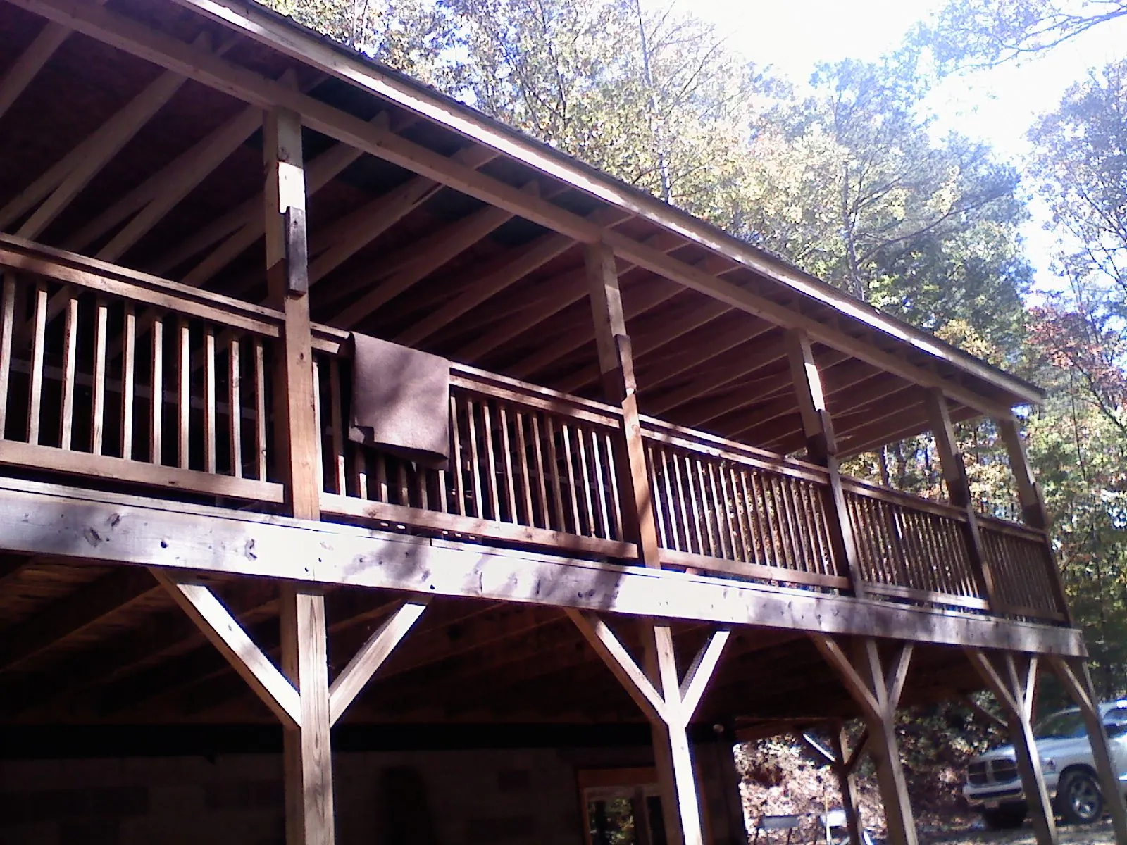 Timber framing under a new elevated porch and deck — Roof Leak Repair in Tow by Roofing Brothers